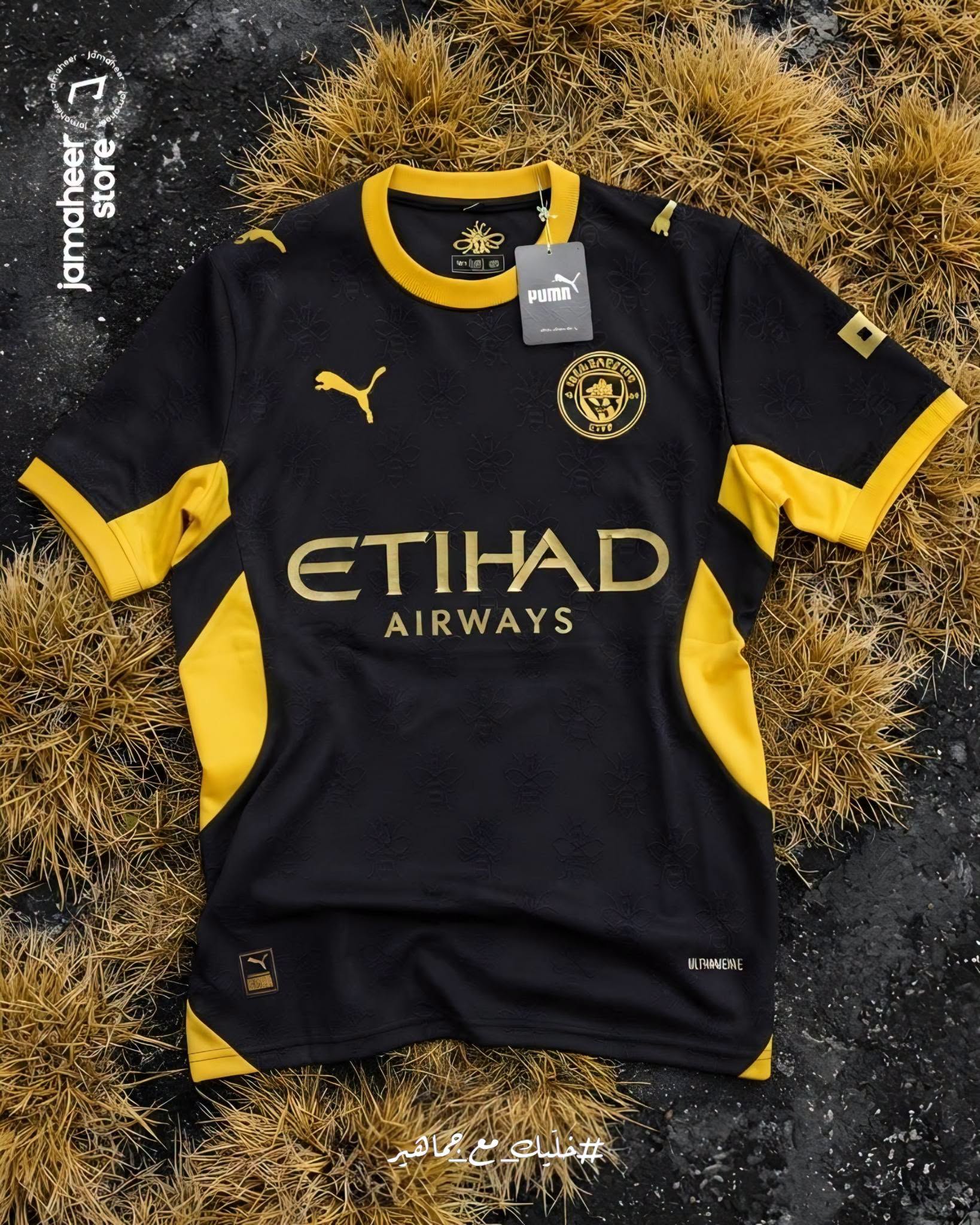 Black and gold Manchester City away shirt on dry grass