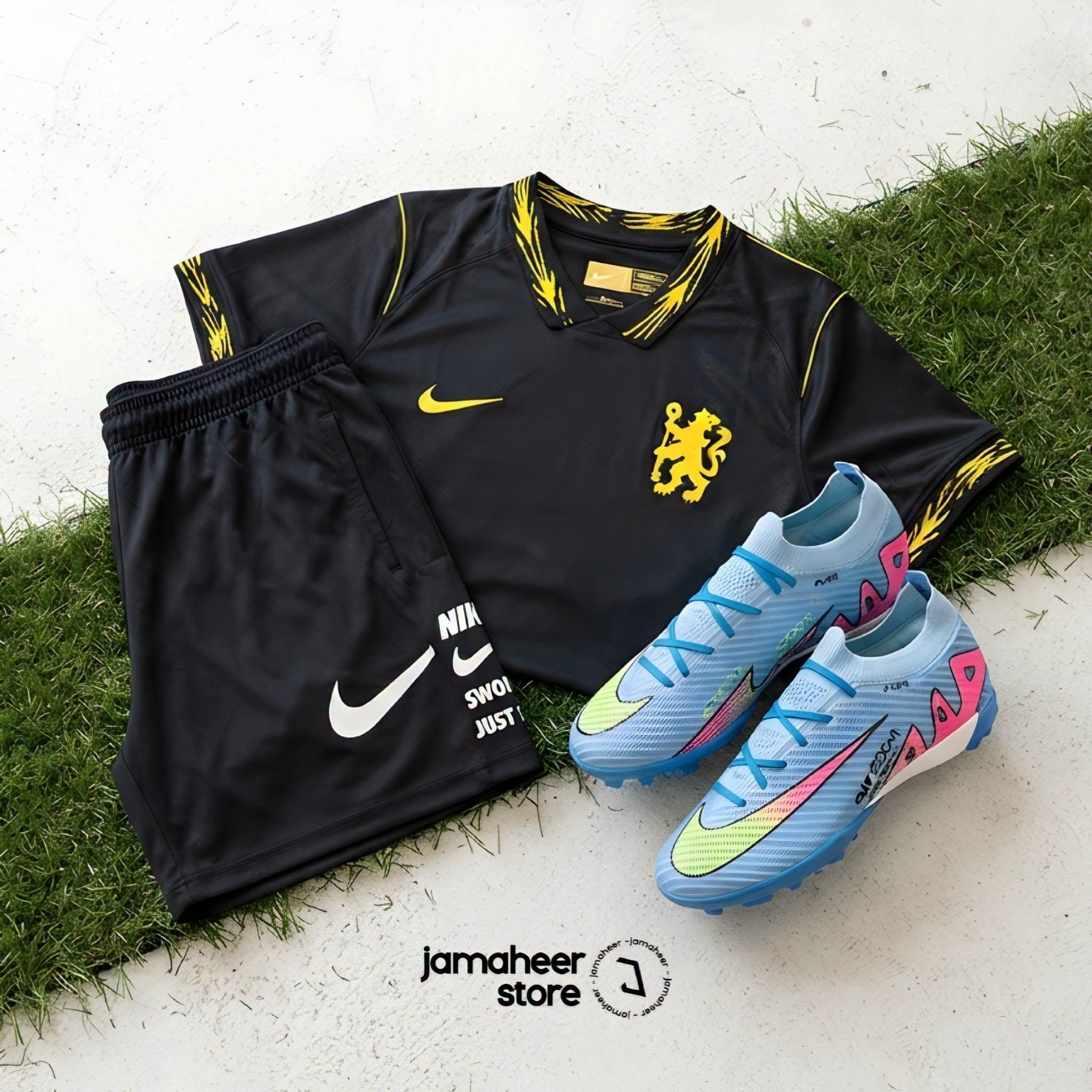 Black Chelsea kit and blue turf boots on the touchline